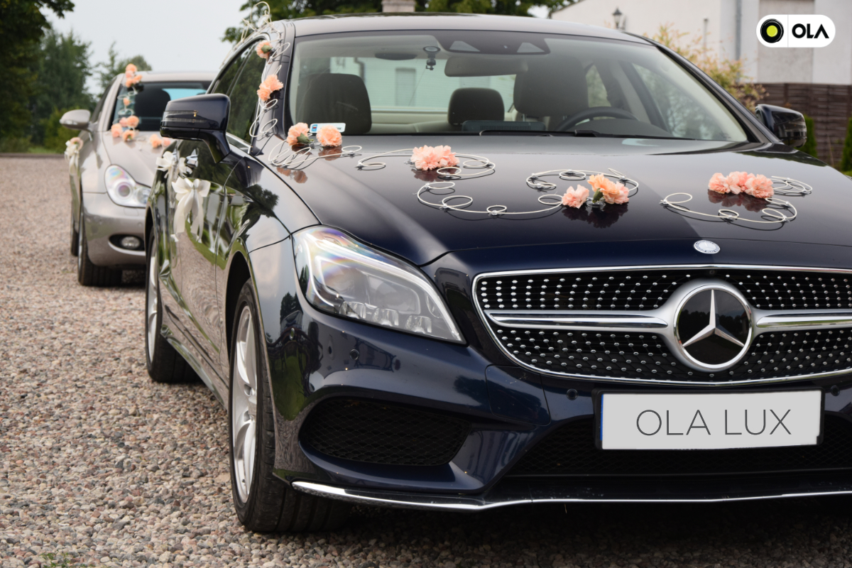 Bialystok, Poland, July 25th 2015: Contemporary and minimalist weddings cars decorations on the Mercedes-Benz CLS. Bride and groom car decorating is the norm during the wedding ceremonies in many countries in the world.